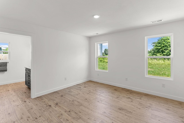 35 Andy Ct, Clark, MO 65243 - unfurnished room featuring light wood-type flooring, plenty of natural light, and recessed lighting