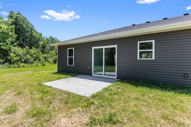 35 Andy Ct, Clark, MO 65243 - rear view of property featuring a patio area and a lawn