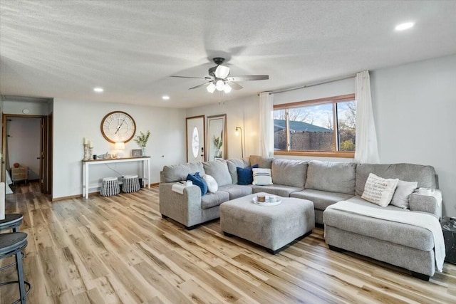28489 Possum Trot Rd, Stover, MO 65078 - living area with light wood-style flooring, ceiling fan, recessed lighting, and a textured ceiling