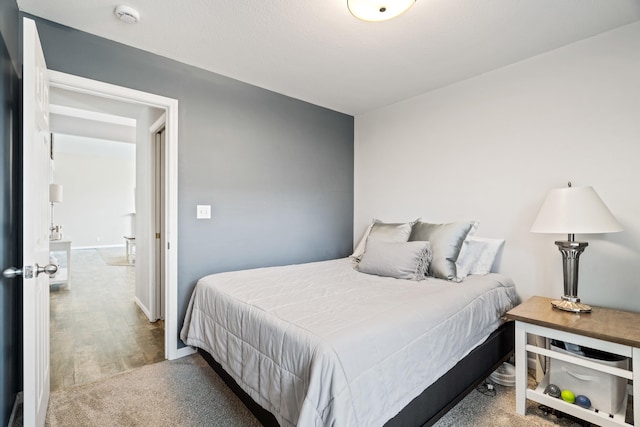 bedroom with wood finished floors