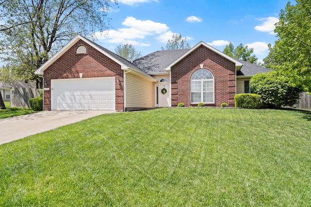 ranch-style house with an attached garage, concrete driveway, a front lawn, and brick siding