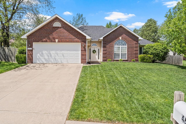 ranch-style house with brick siding, an attached garage, fence, and a front yard