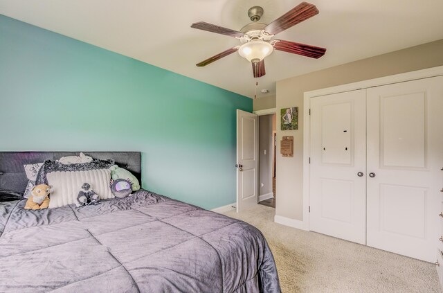 4716 Emeribrook Ct, Columbia, MO 65203 - bedroom featuring baseboards, carpet flooring, a closet, and a ceiling fan