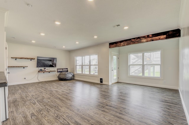 4716 Emeribrook Ct, Columbia, MO 65203 - unfurnished living room featuring visible vents, plenty of natural light, and wood finished floors