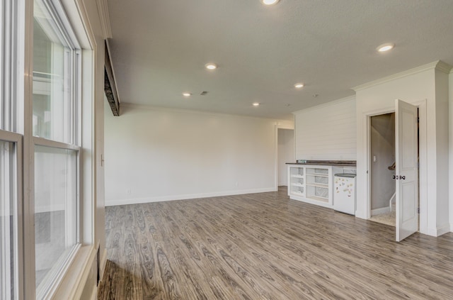 4716 Emeribrook Ct, Columbia, MO 65203 - unfurnished living room with crown molding, wood finished floors, baseboards, and recessed lighting