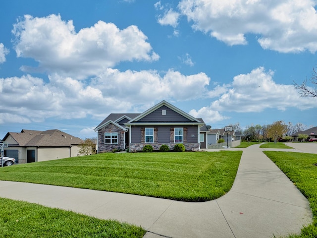 4716 Emeribrook Ct, Columbia, MO 65203 - view of front of house with a front lawn, stone siding, and a residential view