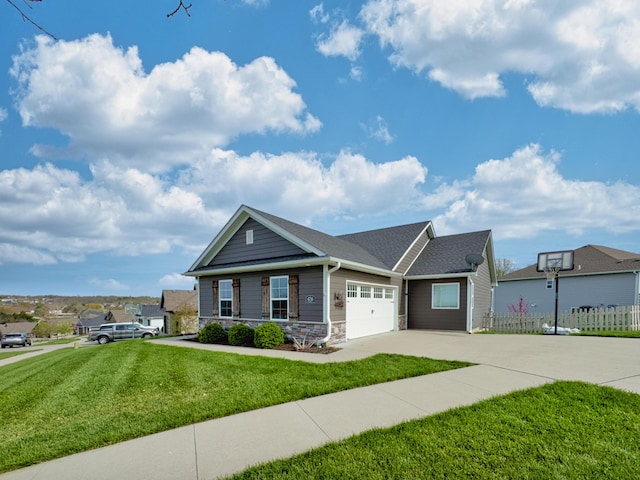 4716 Emeribrook Ct, Columbia, MO 65203 - view of front of home with a garage, fence, stone siding, a front lawn, and concrete driveway