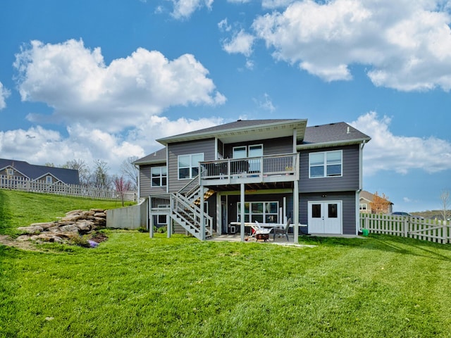 4716 Emeribrook Ct, Columbia, MO 65203 - back of property with a yard, stairway, a patio area, fence, and a deck