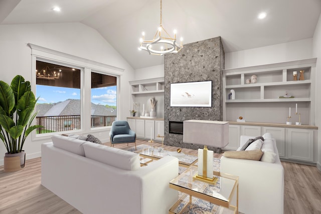 living area featuring a notable chandelier, lofted ceiling, built in features, and light wood finished floors