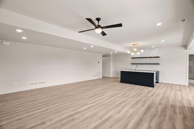 unfurnished living room with visible vents, recessed lighting, and light wood-style floors