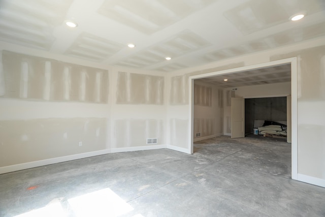 spare room featuring recessed lighting and visible vents