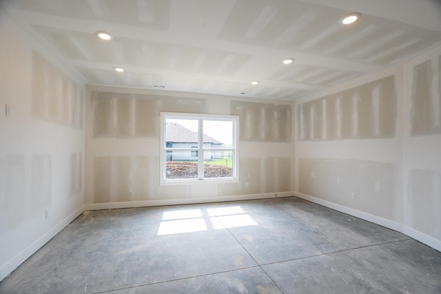 spare room with baseboards and recessed lighting