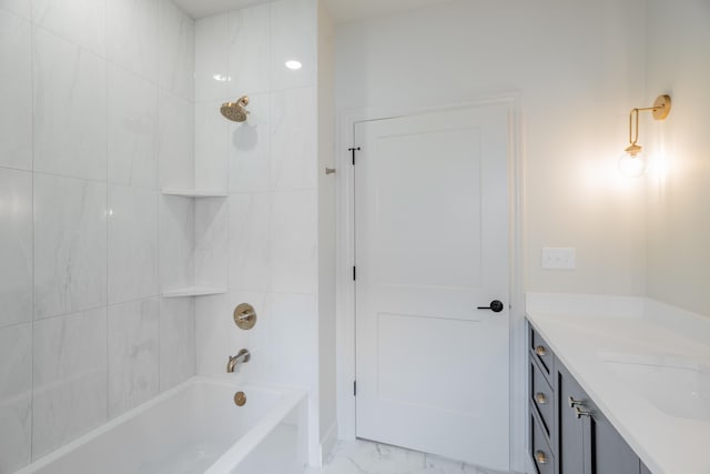full bathroom with shower / bathtub combination, marble finish floor, and vanity