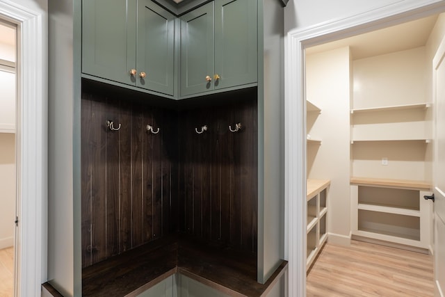 mudroom with light wood finished floors