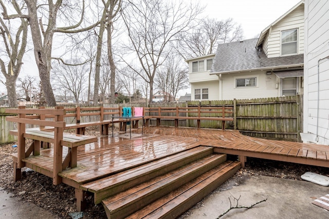 deck with a fenced backyard
