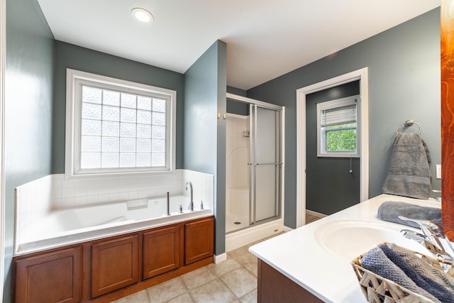 5003 Chesapeake Ln, Columbia, MO 65202 - bathroom featuring a shower stall, vanity, a garden tub, and tile patterned flooring