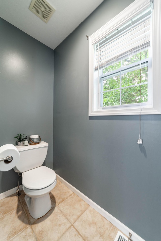 5003 Chesapeake Ln, Columbia, MO 65202 - bathroom with toilet, baseboards, and tile patterned floors