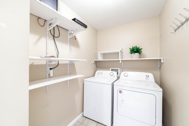 5003 Chesapeake Ln, Columbia, MO 65202 - washroom with separate washer and dryer, baseboards, and tile patterned floors