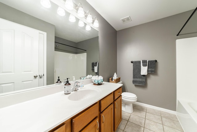 5003 Chesapeake Ln, Columbia, MO 65202 - bathroom with vanity, toilet, tile patterned flooring, baseboards, and shower / bathtub combination