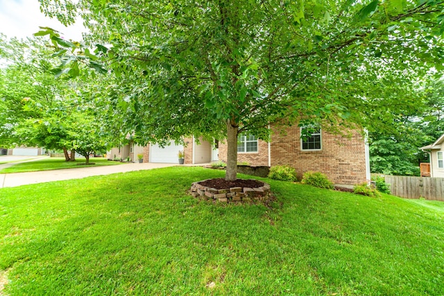 5003 Chesapeake Ln, Columbia, MO 65202 - view of property hidden behind natural elements featuring brick siding, driveway, and a garage