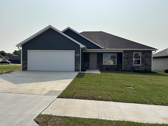 2312 Bitternut Ct, Columbia, MO 65201 - view of front of property with stone siding, a garage, driveway, and a front lawn