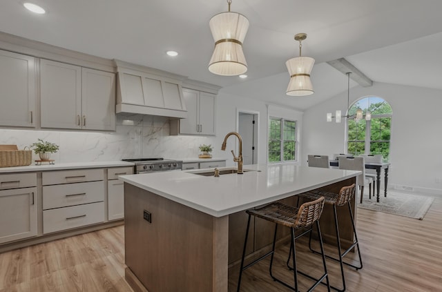 9747 S Rte N, Columbia, MO 65203 - kitchen featuring a sink, custom exhaust hood, light wood-type flooring, light countertops, and recessed lighting
