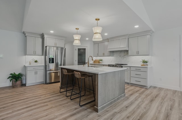 9747 S Rte N, Columbia, MO 65203 - kitchen featuring stainless steel refrigerator with ice dispenser, a sink, recessed lighting, premium range hood, and decorative backsplash