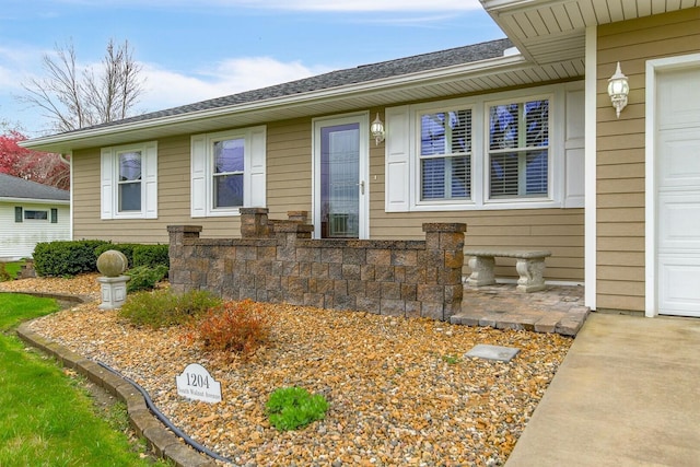 1204 S Walnut Ave, Salisbury, MO 65281 - doorway to property featuring roof with shingles