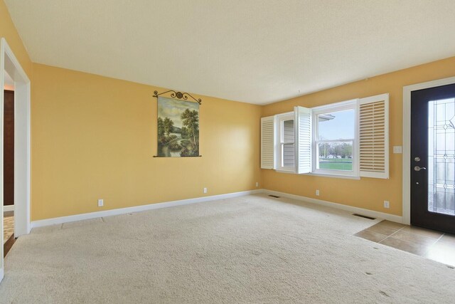 1204 S Walnut Ave, Salisbury, MO 65281 - foyer entrance with visible vents, baseboards, and carpet