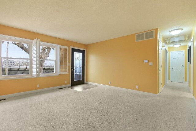 1204 S Walnut Ave, Salisbury, MO 65281 - interior space with visible vents, baseboards, and light carpet