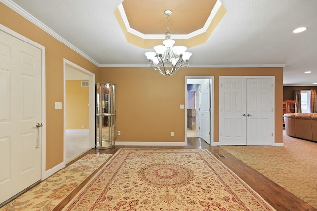 1204 S Walnut Ave, Salisbury, MO 65281 - foyer entrance with crown molding, baseboards, recessed lighting, and a notable chandelier