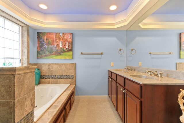 1204 S Walnut Ave, Salisbury, MO 65281 - bathroom with a tray ceiling, a sink, a tub with jets, and baseboards