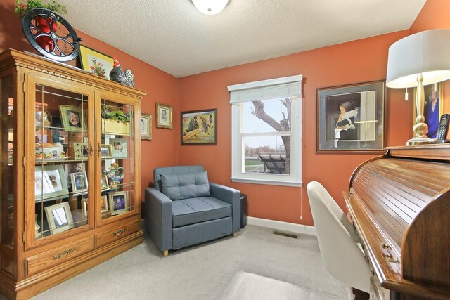 1204 S Walnut Ave, Salisbury, MO 65281 - sitting room featuring a textured ceiling, baseboards, visible vents, and carpet floors