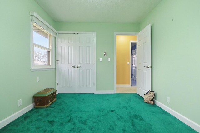 1204 S Walnut Ave, Salisbury, MO 65281 - unfurnished bedroom with a closet, baseboards, and carpet floors