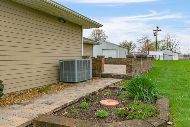 1204 S Walnut Ave, Salisbury, MO 65281 - view of yard with a garage, central AC, and an outbuilding