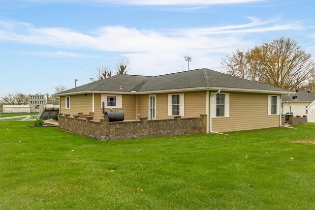 1204 S Walnut Ave, Salisbury, MO 65281 - back of property with heating fuel and a lawn