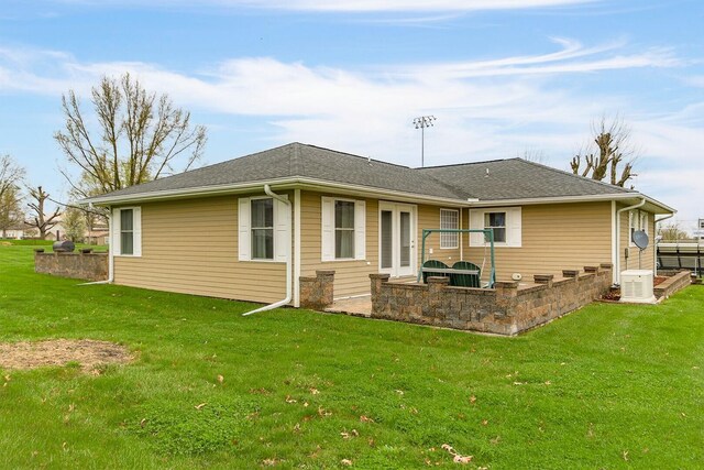 1204 S Walnut Ave, Salisbury, MO 65281 - back of property with a patio area and a lawn