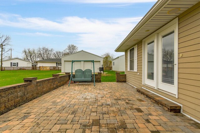 1204 S Walnut Ave, Salisbury, MO 65281 - view of patio featuring a garage, an outdoor structure, and fence