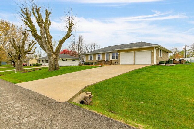 1204 S Walnut Ave, Salisbury, MO 65281 - ranch-style home featuring an attached garage, a front lawn, and concrete driveway