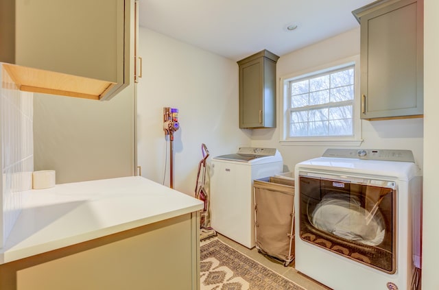 laundry area featuring cabinet space and washer and clothes dryer