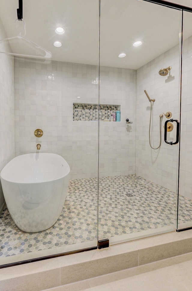 bathroom featuring a shower stall and recessed lighting