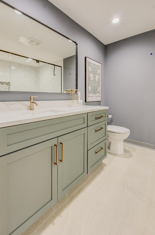 full bathroom with toilet, vanity, baseboards, and recessed lighting