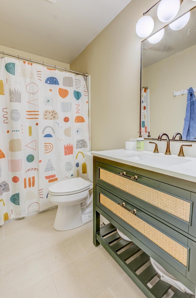 full bath with a shower with shower curtain, tile patterned floors, vanity, and toilet