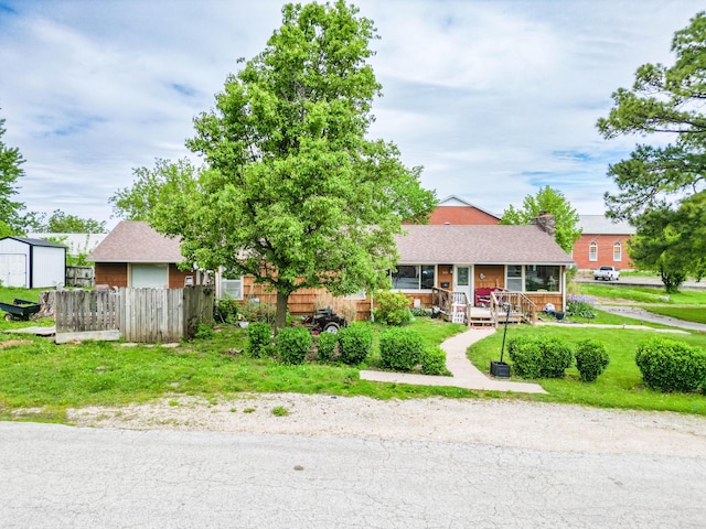 509 S Bus-54, Fulton, MO 65251 - view of front of home featuring a front lawn, a porch, roof with shingles, and fence