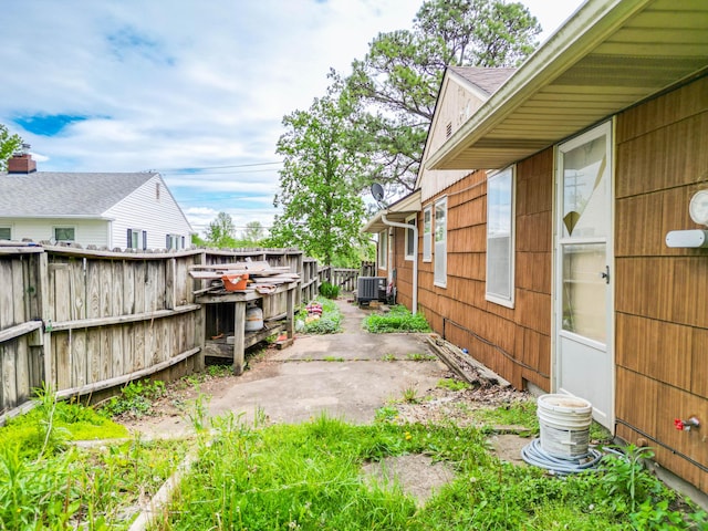 509 S Bus-54, Fulton, MO 65251 - view of yard featuring central air condition unit, fence, and a patio area