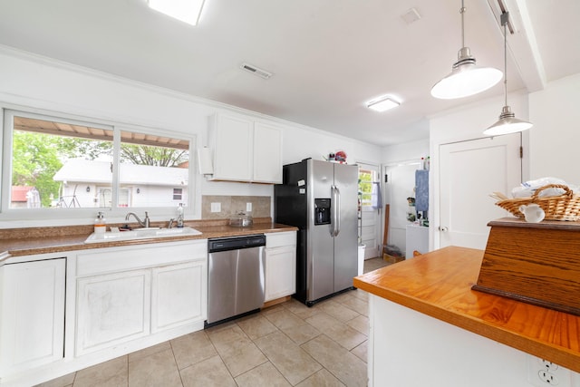 509 S Bus-54, Fulton, MO 65251 - kitchen with a sink, stainless steel appliances, a healthy amount of sunlight, and white cabinets