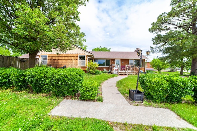 509 S Bus-54, Fulton, MO 65251 - back of house with a lawn, fence, brick siding, and a deck