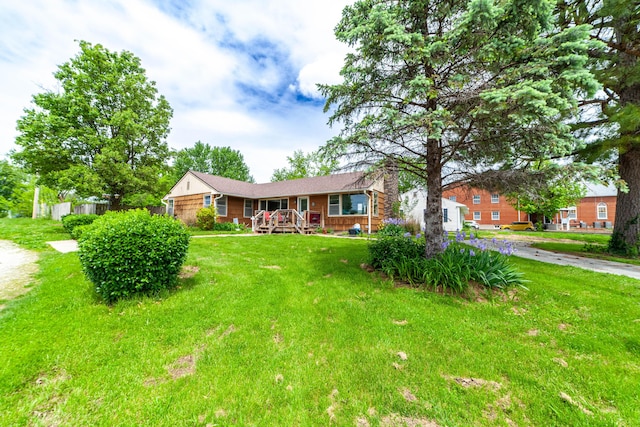 509 S Bus-54, Fulton, MO 65251 - ranch-style house with covered porch, fence, a chimney, and a front yard