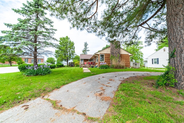 509 S Bus-54, Fulton, MO 65251 - view of front of house with a front lawn, a chimney, and curved driveway