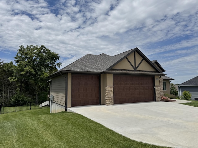 5005 Kiawah Ln, Columbia, MO 65203 - tudor house with concrete driveway, stone siding, an attached garage, stucco siding, and a shingled roof